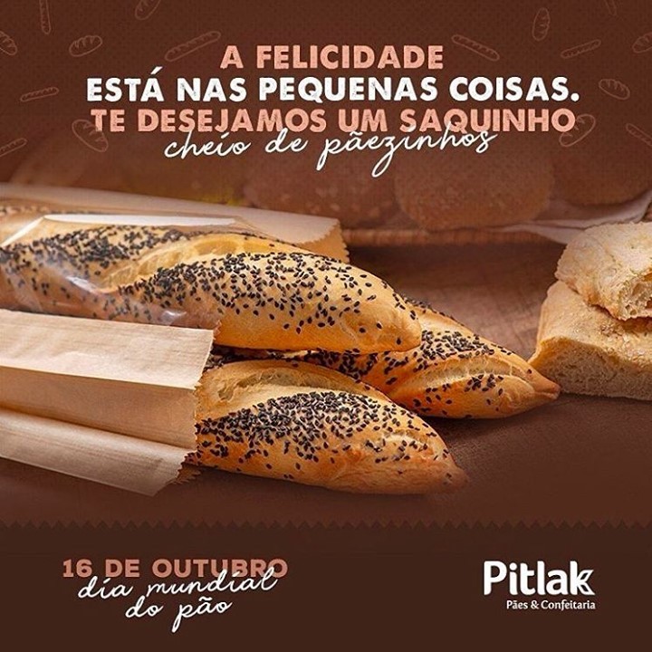 Pitlak's Instagram post for World Bread Day, featuring artisan bread rolls with black sesame